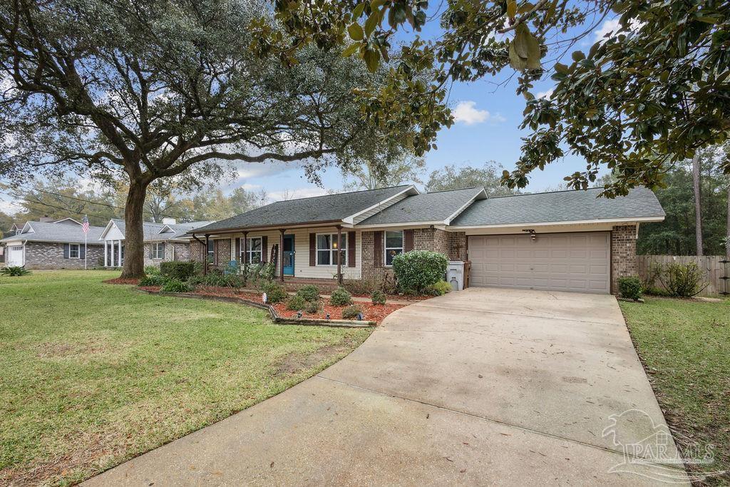 5132 Rowe Trail Pace, FL 32571 - Photo 3 of 26 front view of a house with a yard
