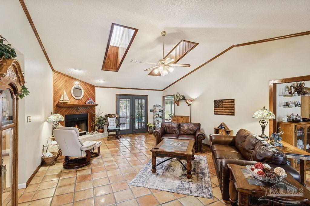 5132 Rowe Trail Pace, FL 32571 - Photo 5 of 26 a living room with fireplace furniture and a large window