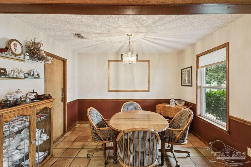 5132 Rowe Trail Pace, FL 32571 - Photo 6 of 26 a view of a dining room with furniture window and outside view