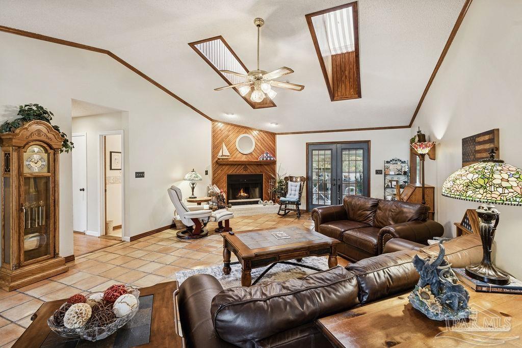 5132 Rowe Trail Pace, FL 32571 - Photo 7 of 26 a living room with furniture and a fireplace
