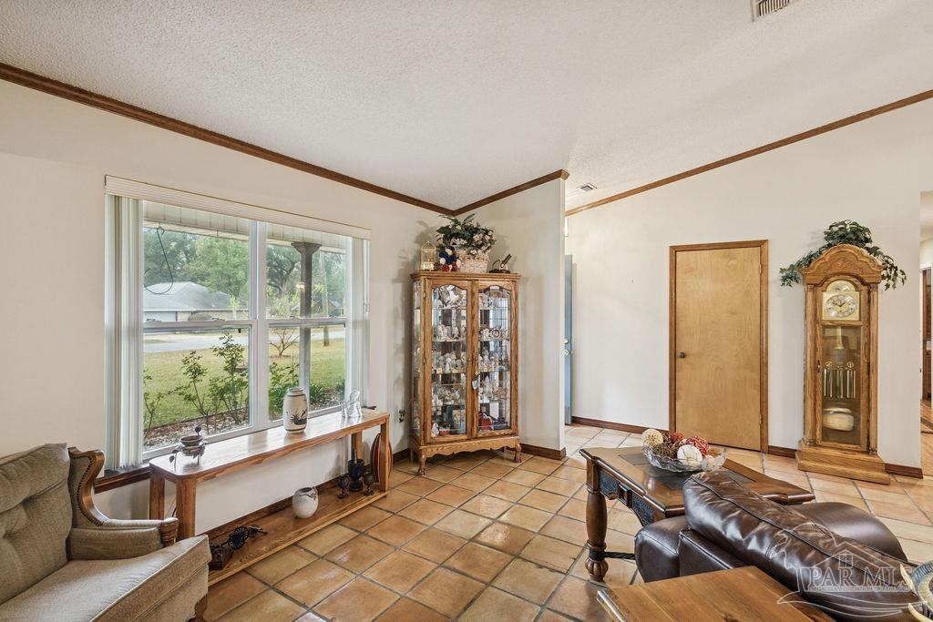 5132 Rowe Trail Pace, FL 32571 - Photo 8 of 26 a living room with furniture and a window