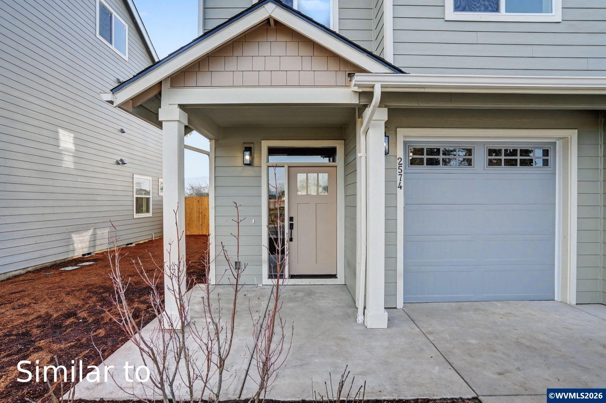 2550 Promise Way Lebanon, OR 97355 - Photo 3 of 35 a view of a house with a door and wooden wall