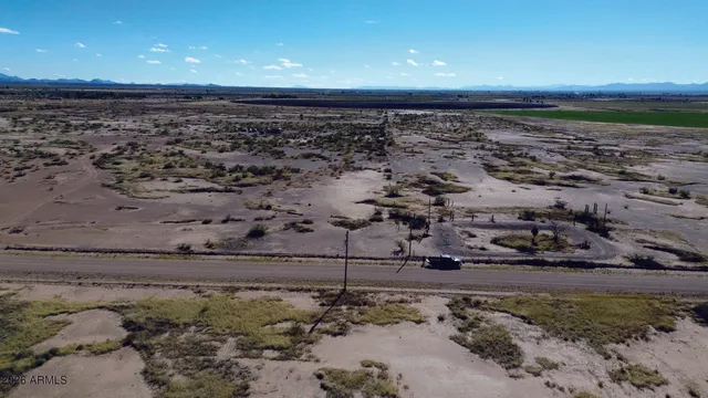 a view of mountain with wooden floor and a mountain view