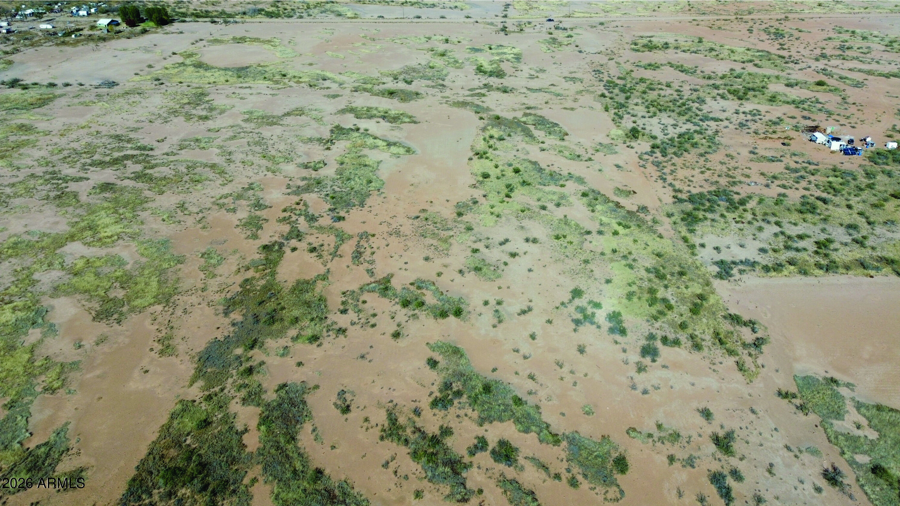 4.10-ac Thompson Road, Unit B Elfrida, AZ 85610 - Photo 9 of 34 a view of a dry yard with lots of bushes