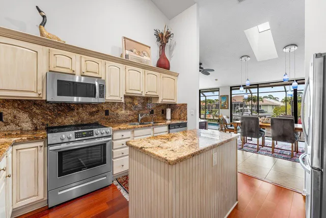 a bedroom with a large bed and flat tv