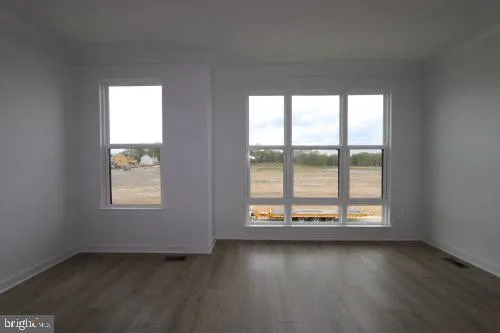 a bathroom with a double vanity sink toilet mirror and shower