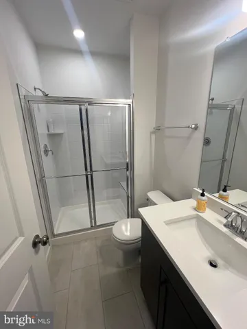 a view of a cars park in front of a building