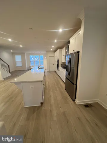 a view of a kitchen with furniture and a window