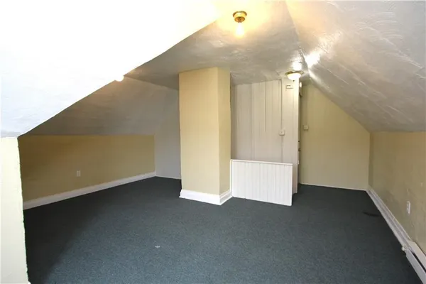 an empty room with a empty space and windows