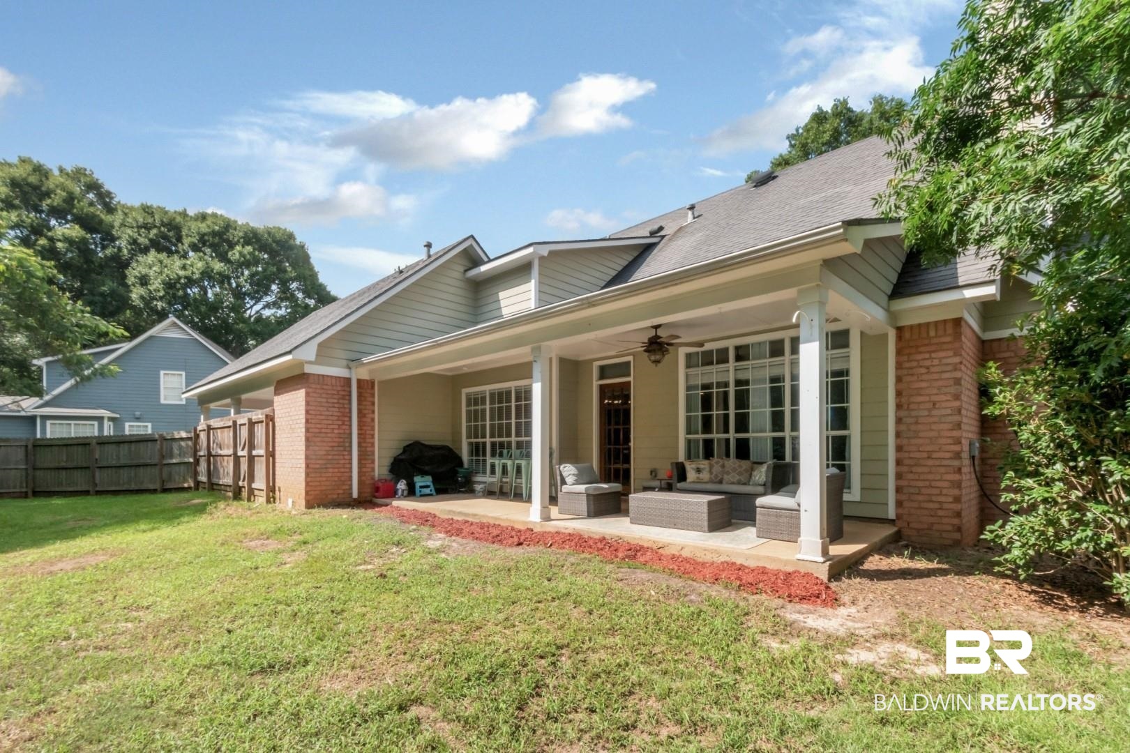 9991 Wedgefield Court Mobile, AL 36608 - Photo 26 of 30 Rear view of property featuring a patio, an outdoor living space, a lawn, and ceiling fan