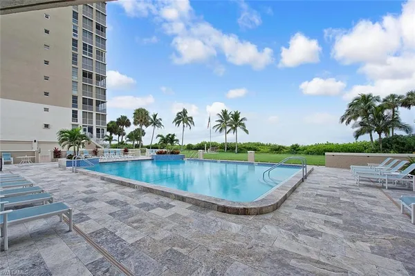 a view of swimming pool with a yard