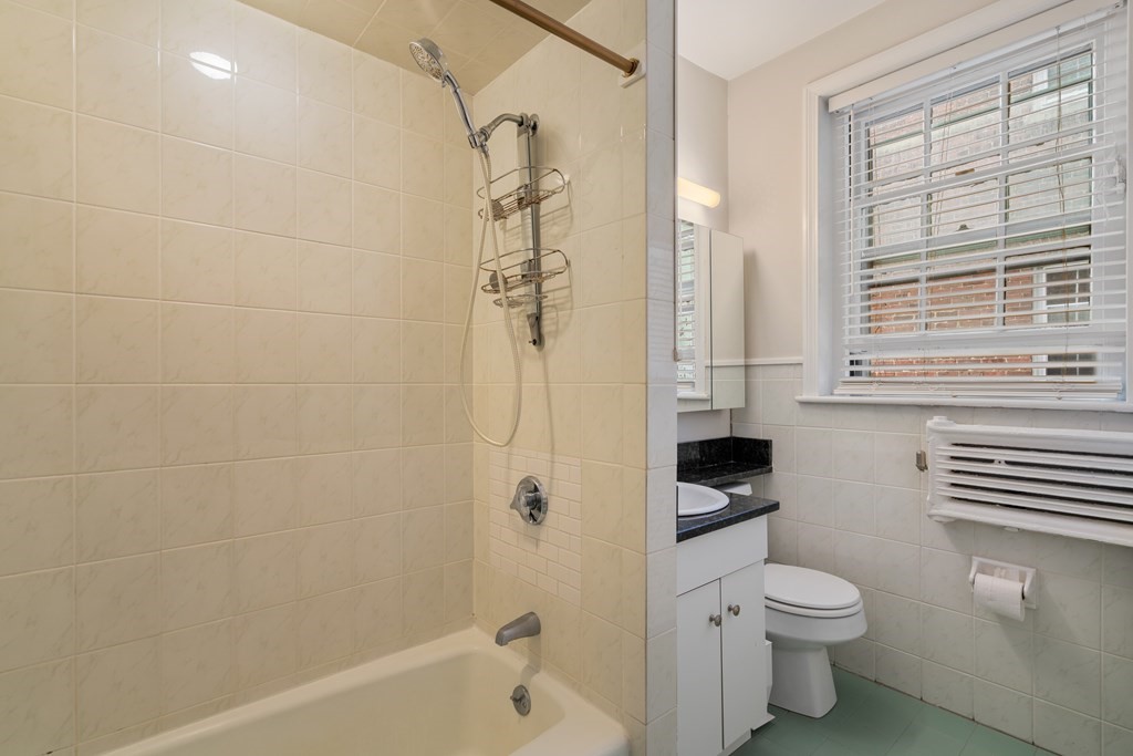 43 Linnaean Street, Unit 32 Cambridge, MA 02138 - Photo 12 of 20 a bathroom with a toilet a sink and shower