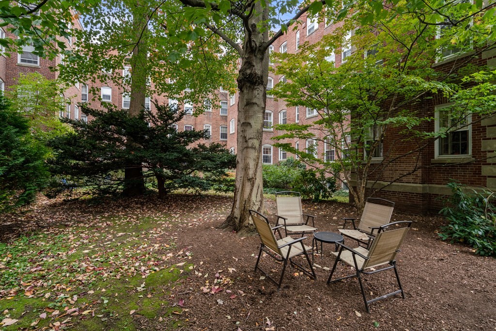 43 Linnaean Street, Unit 32 Cambridge, MA 02138 - Photo 16 of 20 a view of a chairs and table in backyard
