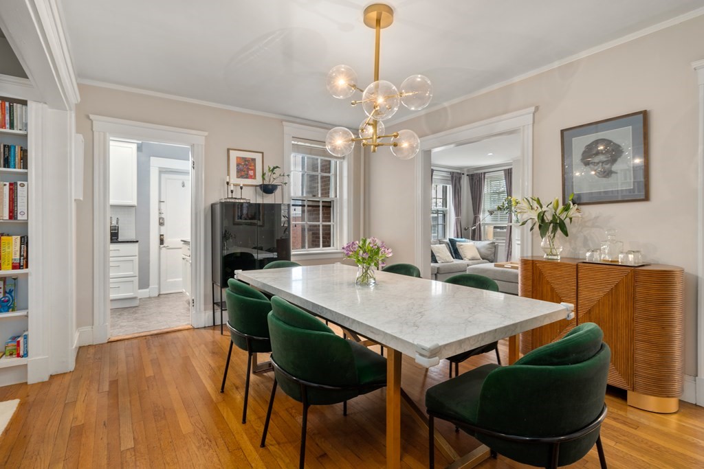 43 Linnaean Street, Unit 32 Cambridge, MA 02138 - Photo 5 of 20 a view of a dining room with furniture window and wooden floor