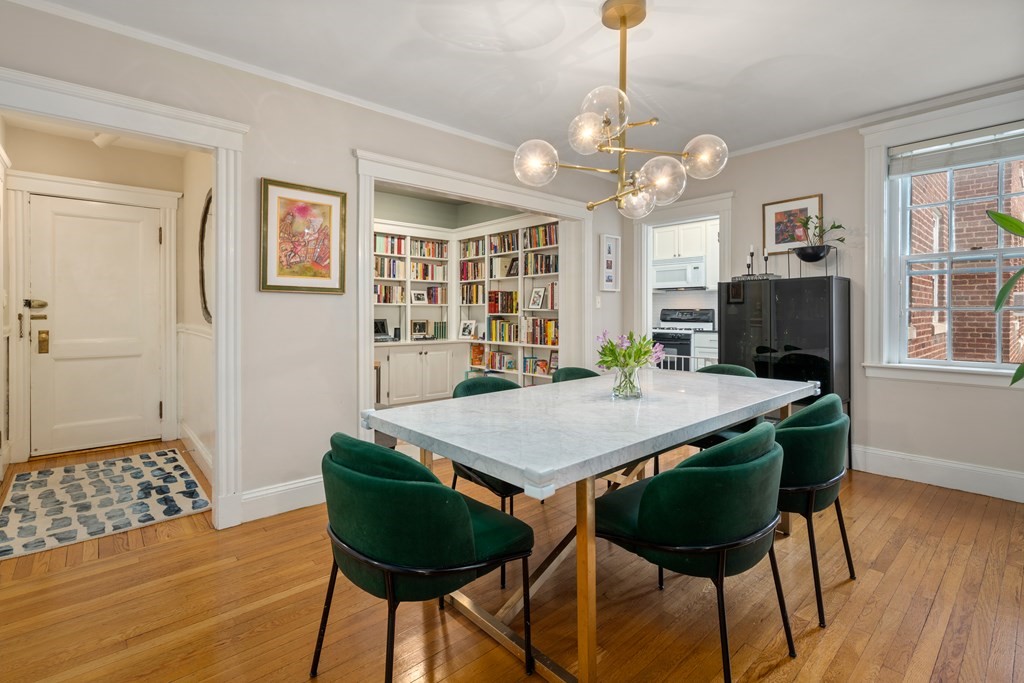 43 Linnaean Street, Unit 32 Cambridge, MA 02138 - Photo 6 of 20 a view of a dining room with furniture and wooden floor