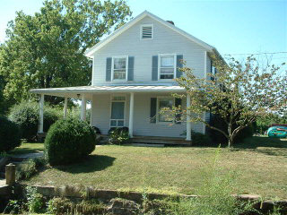 7749 Thomas Spring Road Bridgewater, VA 22812 - Photo 1 of 1 a front view of a house with garden