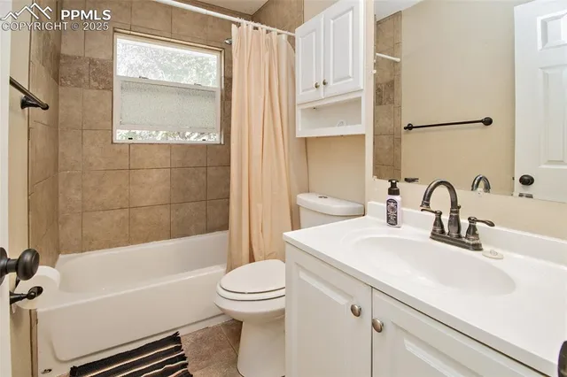 a bathroom with a sink a toilet and a bathtub