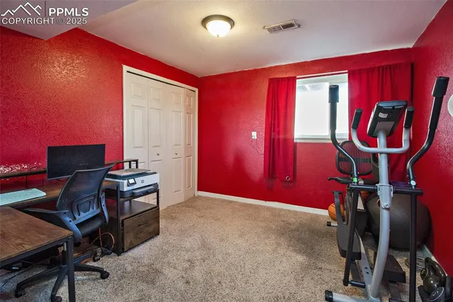 a workspace with furniture and musical instruments