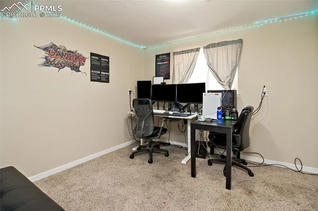 a view of a workspace with furniture