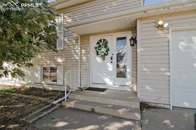 a front view of a house with a garage