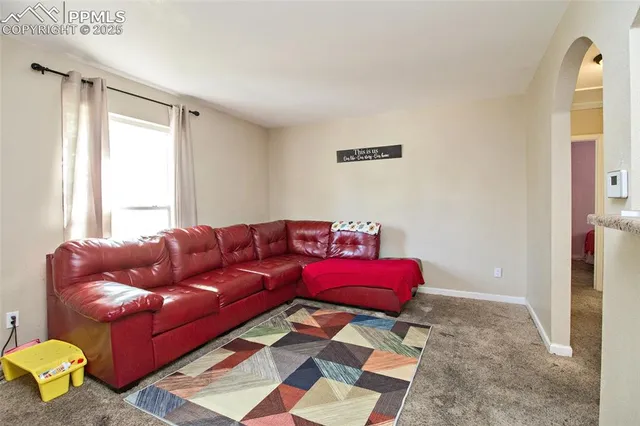 a living room with a couch and a table