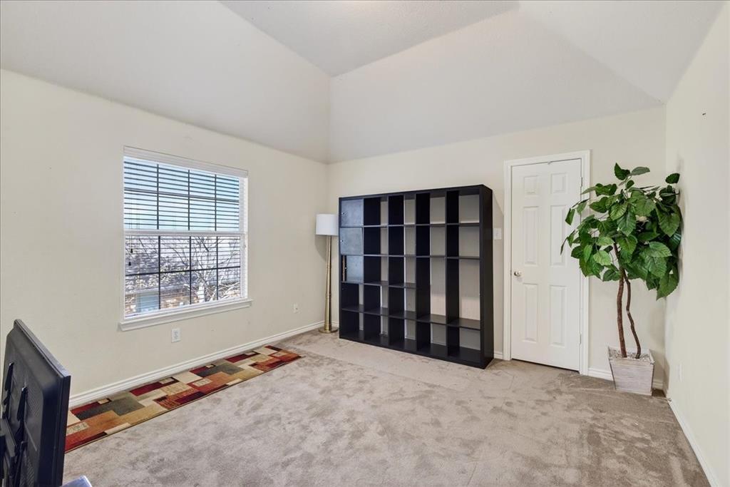 7308 Hawk Lane Sachse, TX 75048 - Photo 30 of 37 a view of an empty room with a window and a potted plant