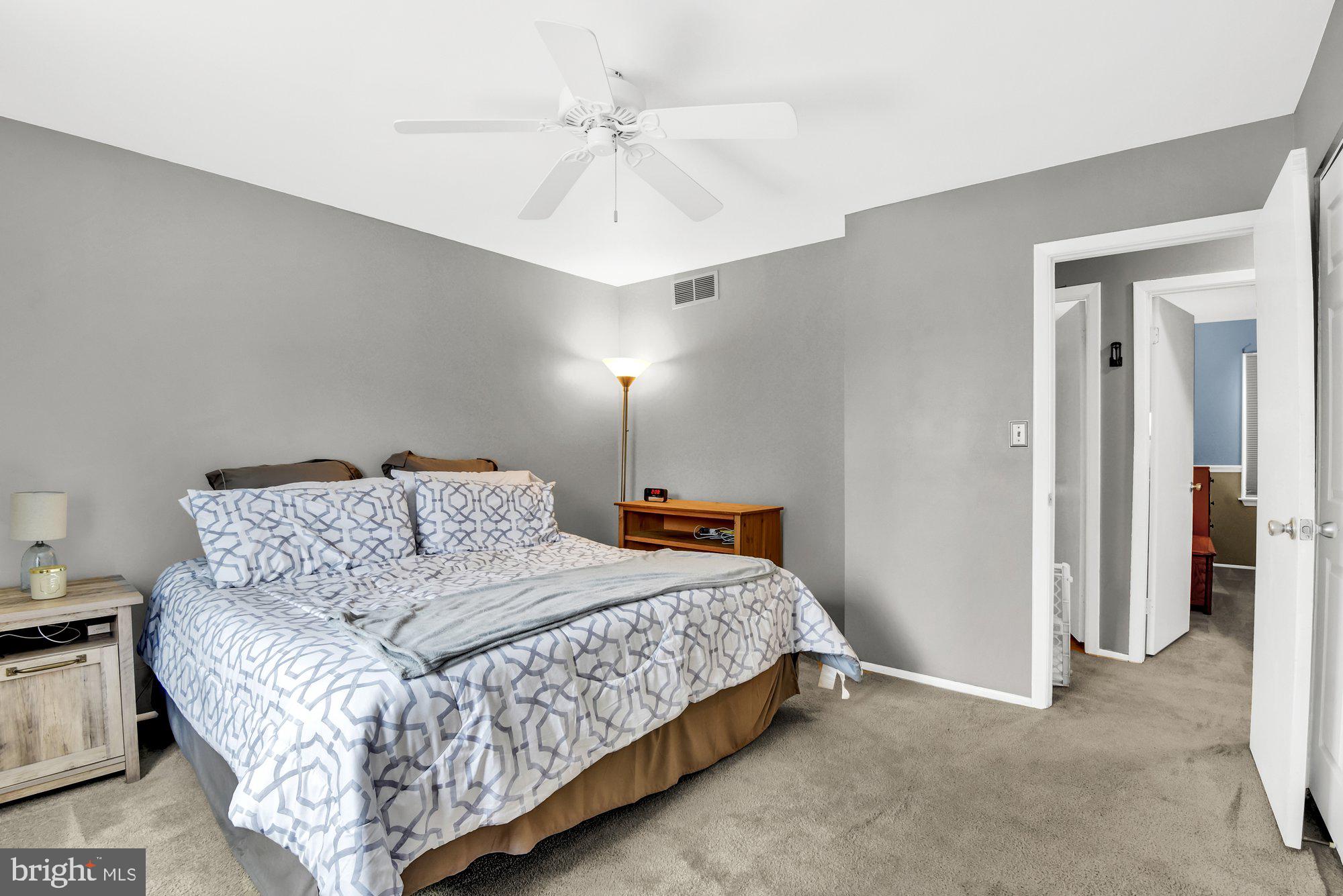 806 Uniontown Road Westminster, MD 21158 - Photo 8 of 10 a bedroom with a bed and a chandelier
