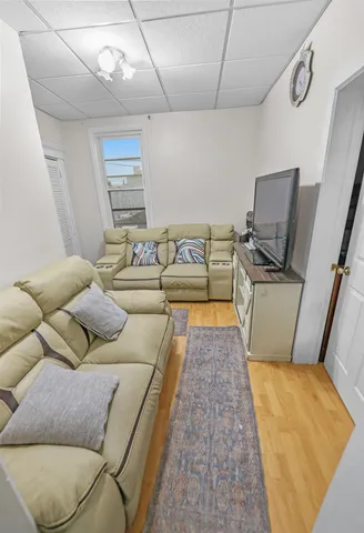 a living room with furniture and a rug