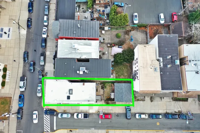 an aerial view of a building with garden