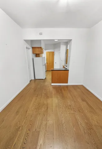 a view of a big room with wooden floor