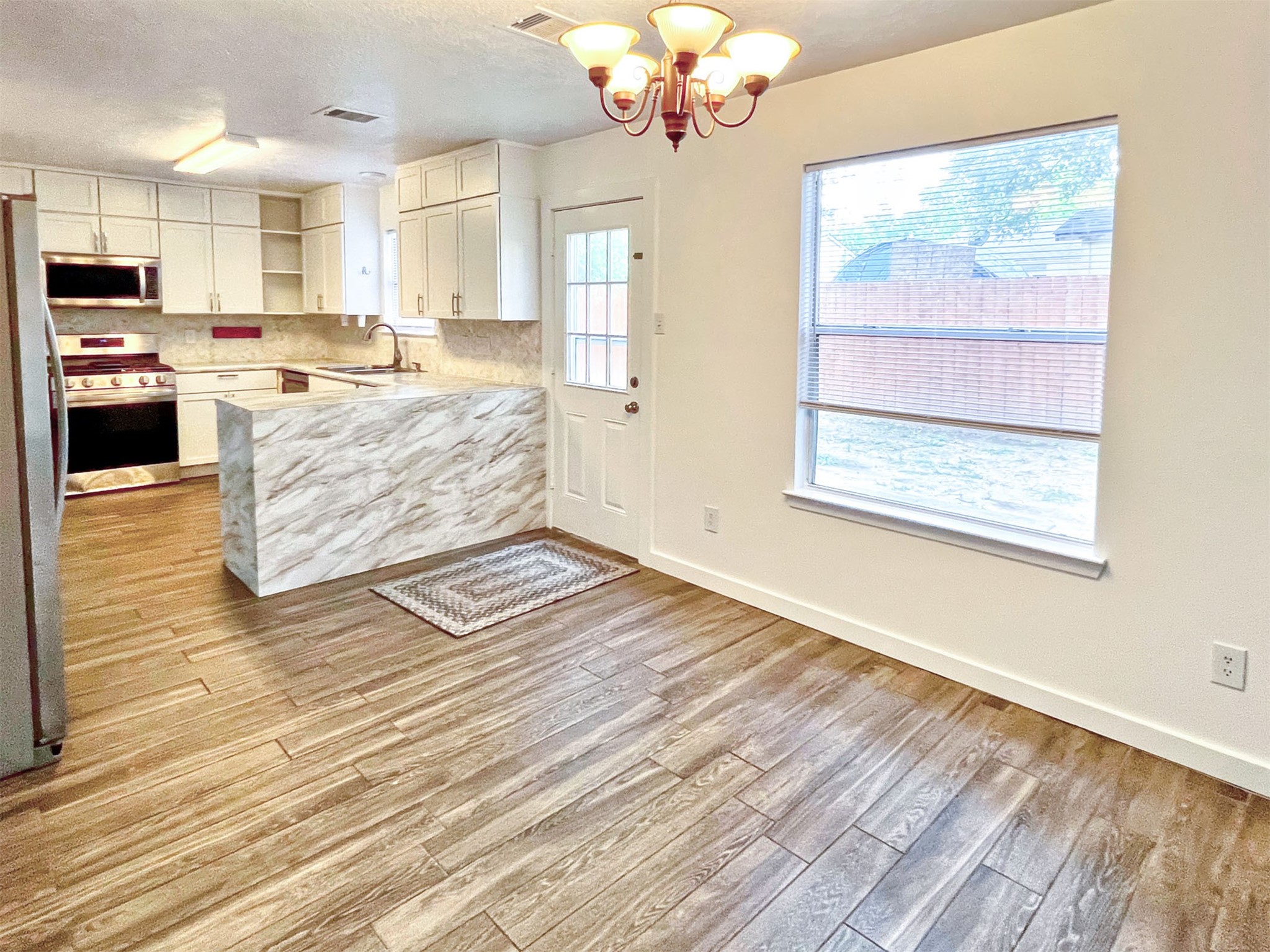 17250 April Valley Court Houston, TX 77084 - Photo 12 of 33 Bright Kitchen and Dining Combination