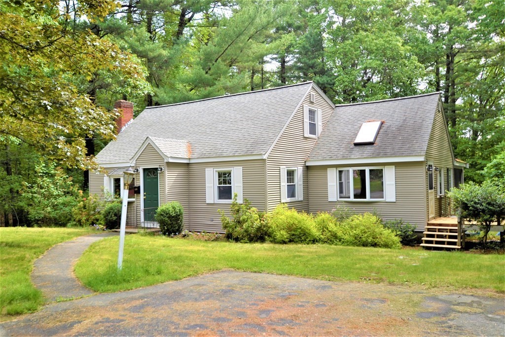 a view of a house with a yard and plants