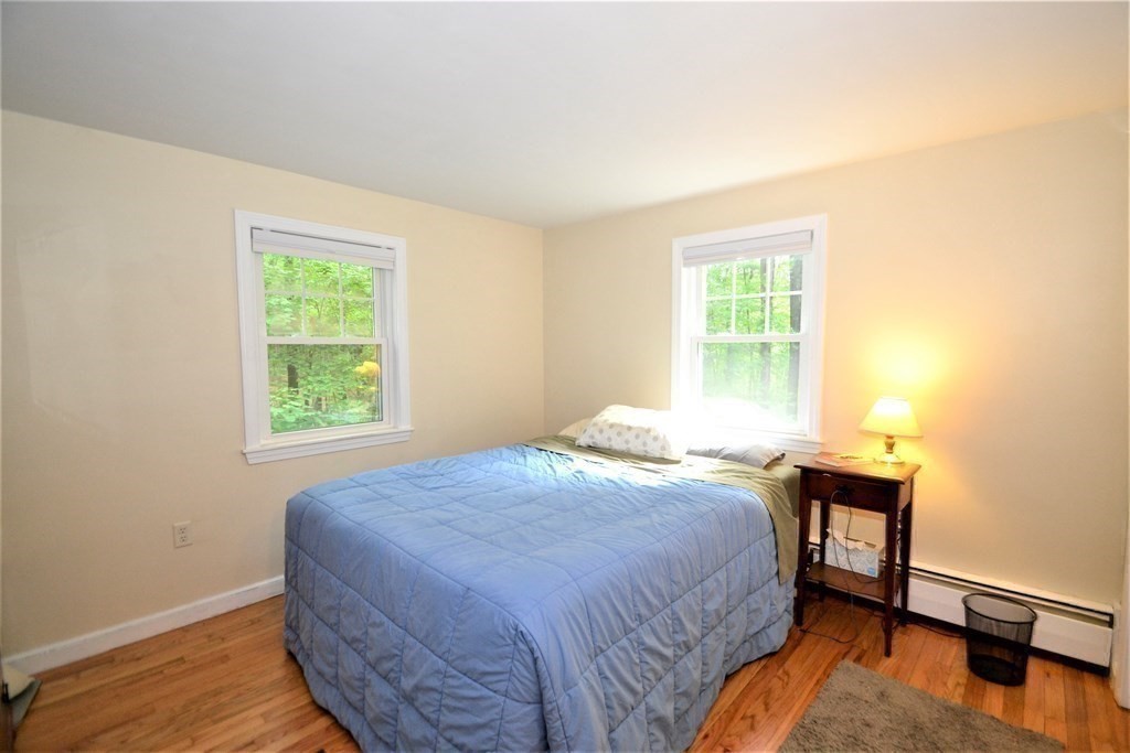 95 Pine Hill Road Ashland, MA 01721 - Photo 16 of 30 a bed sitting in a bedroom next to a window