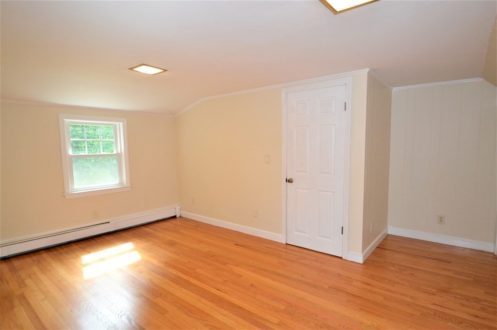 95 Pine Hill Road Ashland, MA 01721 - Photo 21 of 30 an empty room with wooden floor and windows