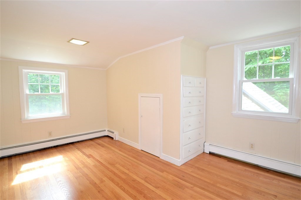 95 Pine Hill Road Ashland, MA 01721 - Photo 23 of 30 an empty room with wooden floor and windows