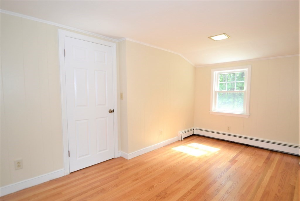 95 Pine Hill Road Ashland, MA 01721 - Photo 24 of 30 an empty room with wooden floor and windows