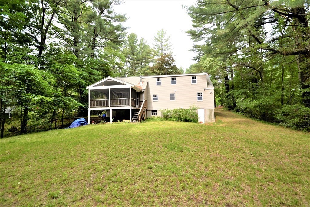 95 Pine Hill Road Ashland, MA 01721 - Photo 26 of 30 a front view of a house with a yard and trees