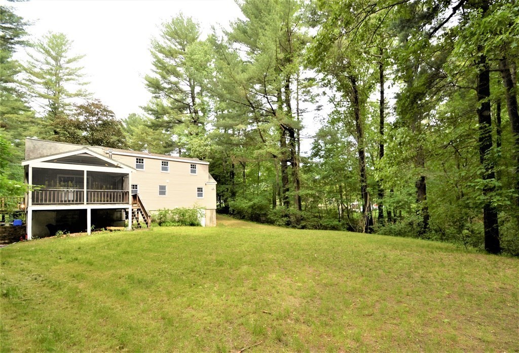 95 Pine Hill Road Ashland, MA 01721 - Photo 27 of 30 a view of a house with a yard and large trees
