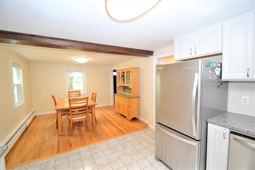 95 Pine Hill Road Ashland, MA 01721 - Photo 5 of 30 a kitchen with stainless steel appliances granite countertop a refrigerator and a stove