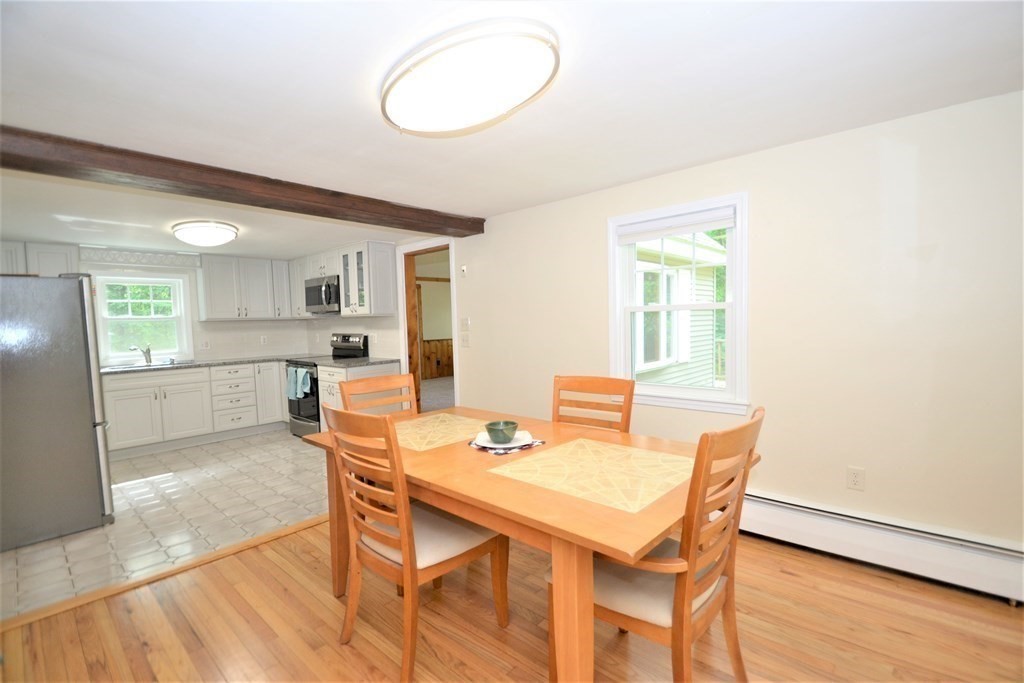 95 Pine Hill Road Ashland, MA 01721 - Photo 6 of 30 a view of a dining room with furniture and wooden floor