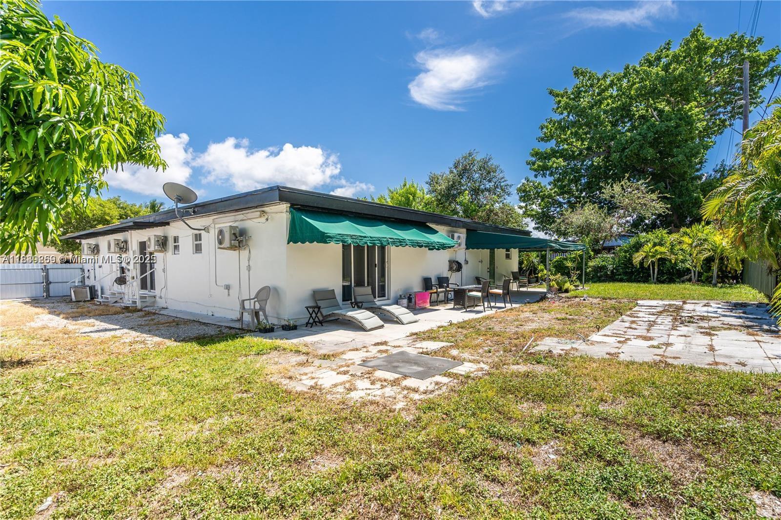1761 Southwest 14th Street Miami, FL 33145 - Photo 4 of 37 a view of a house with backyard and sitting area