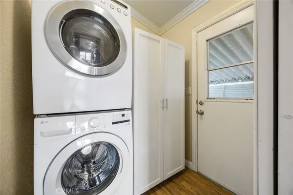a view of a hallway with washer and dryer