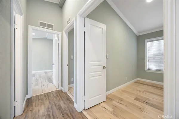 a view of a bedroom from a hallway