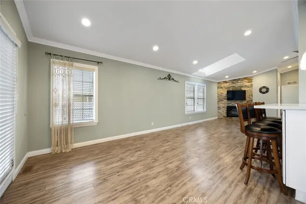 a view of a livingroom with furniture and a flat screen tv