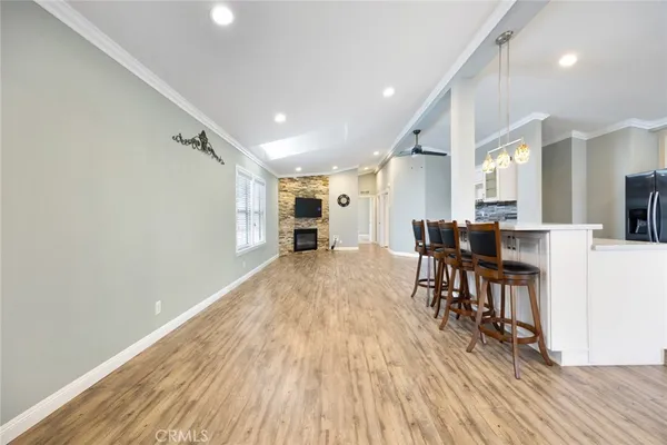 a view of kitchen with cabinets and wooden floor