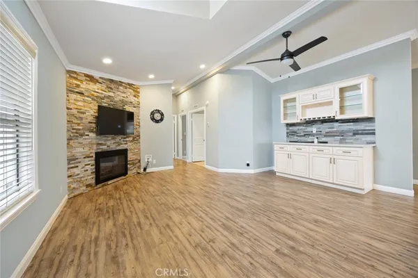a large kitchen with kitchen island a sink stainless steel appliances and cabinets