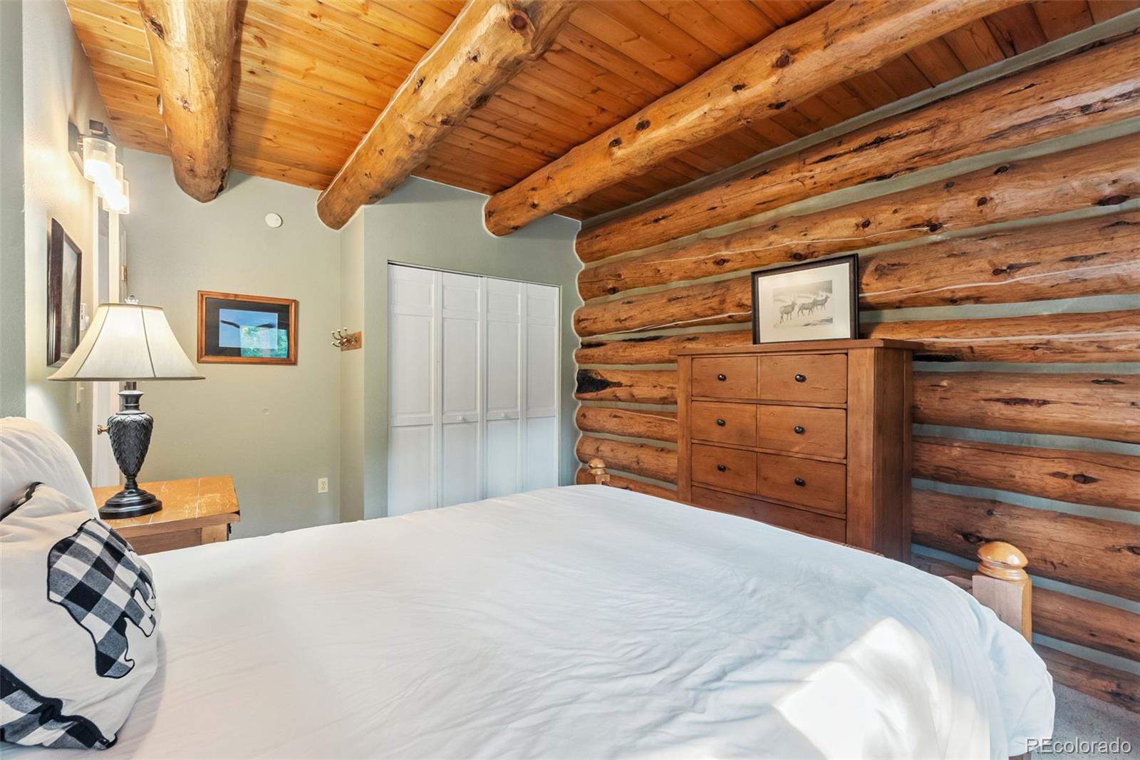 46 Indiana Creek Road Breckenridge, CO 80424 - Photo 12 of 50 a bedroom with a bed and a dresser