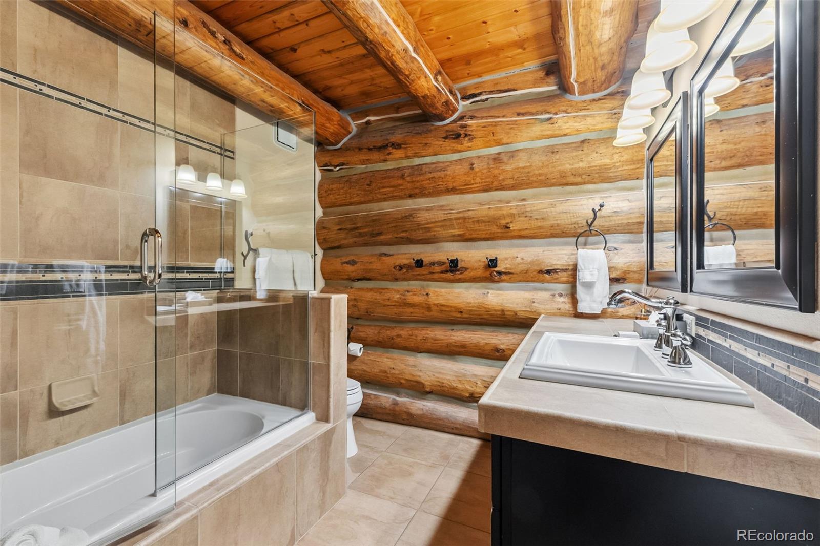 46 Indiana Creek Road Breckenridge, CO 80424 - Photo 13 of 50 a bathroom with a bathtub and shower