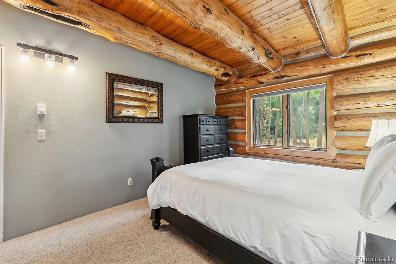 46 Indiana Creek Road Breckenridge, CO 80424 - Photo 14 of 50 a bedroom with a bed and a large window
