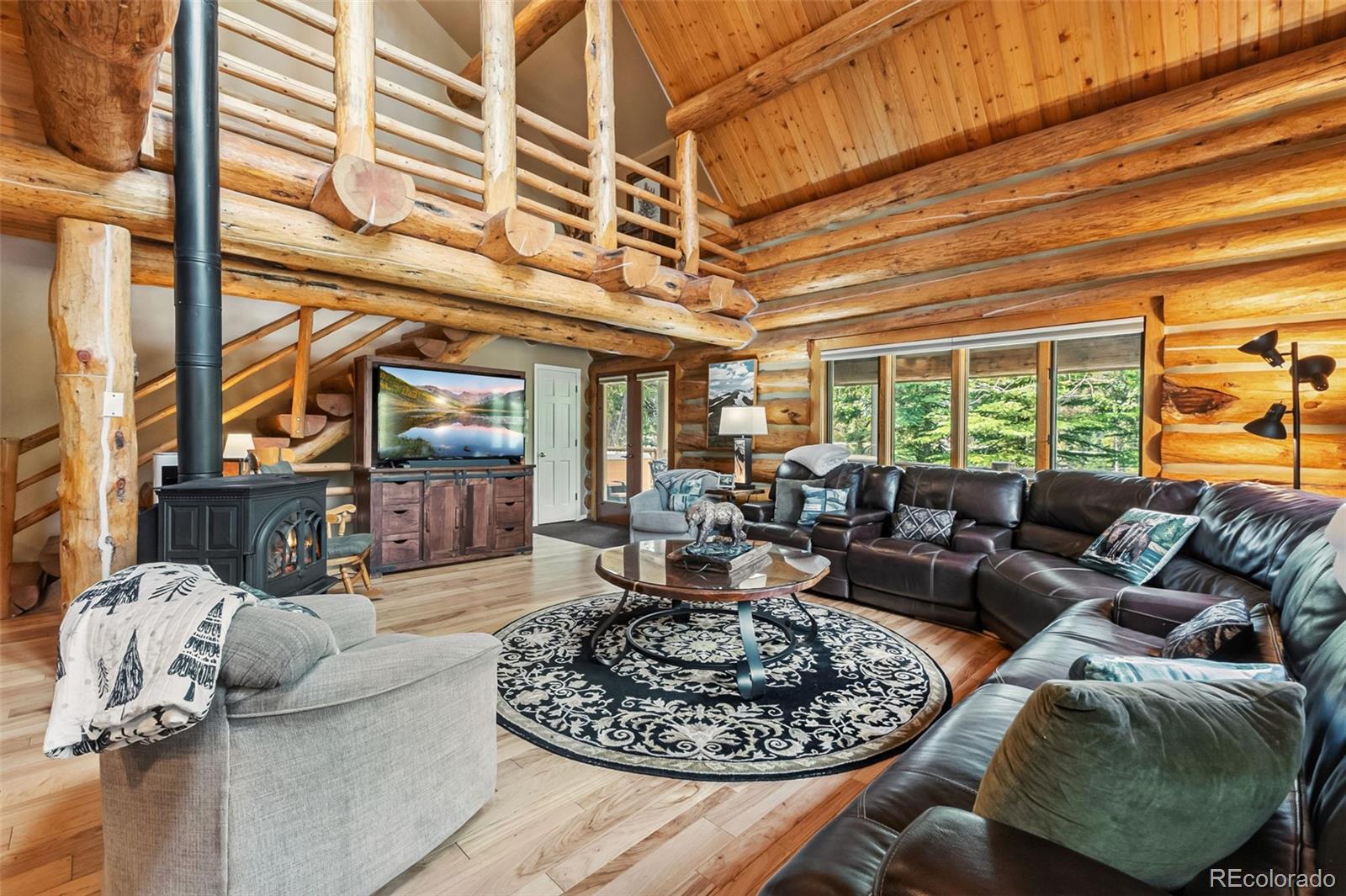 46 Indiana Creek Road Breckenridge, CO 80424 - Photo 2 of 50 a living room with furniture and a large window